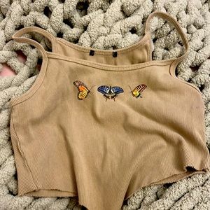 tan shirt with butterflys